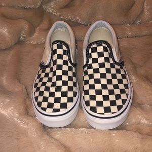 Kids Vans black and white checkered shoes.